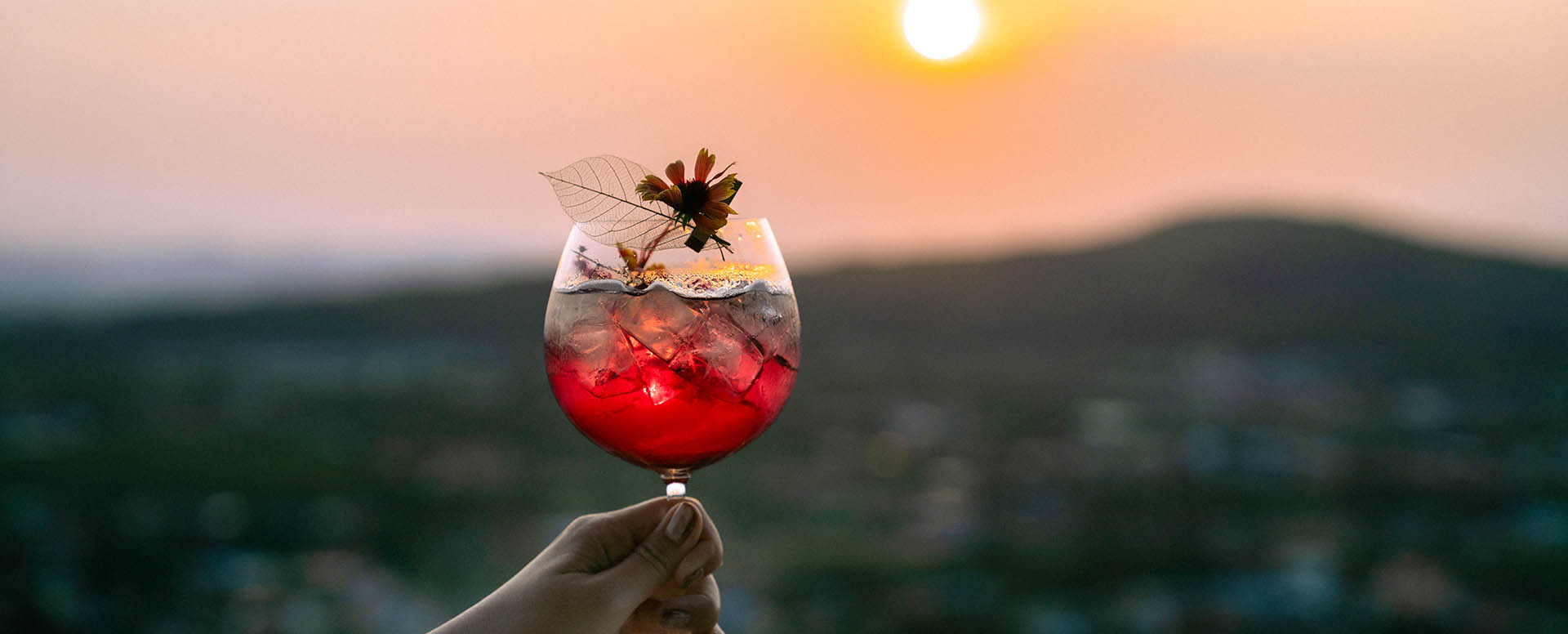 Drink with sunset view at vana nava sky rooftop